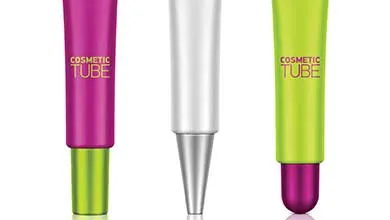 Three cosmetic tubes on a white background: one magenta with a green cap, one white with a silver applicator tip, and one lime green with a magenta cap.