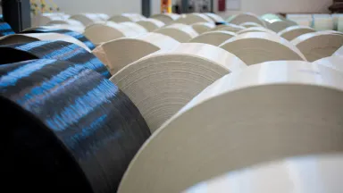 Spools of industrial glass and carbon fiber